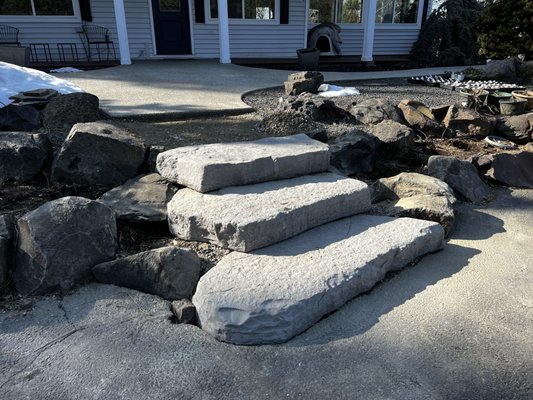 2023 Stair Replacement - These slate steps were crumbling and in pretty bad shape. The client is going to be hosting a wedding later this year and needed something that would not only look better, but also be safter for the guests. We removed the old stones and installed a concrete product that has irregular shapes to provide the attractiveness of natural stone with the safety and comfort of a uniform rise. 2023 Stair Replacement - These slate steps were crumbling and in pretty bad shape. The client is going to be hosting a wedding later this year and needed something that would not only look better, but also be safter for the guests. We removed the old stones and installed a concrete product that has irregular shapes to provide the attractiveness of natural stone with the safety and comfort of a uniform rise.