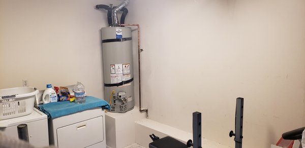 Drywall repair and water heater replacement - The repair was needed because an old water heater leaked and caused damage to the drywall.