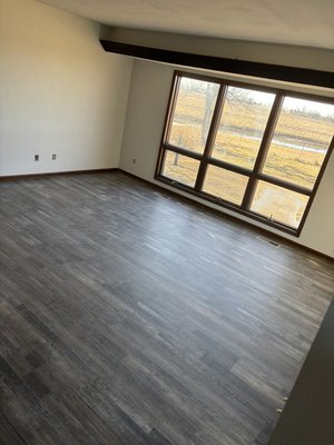 Winter 2024/2025 Mcelwain Project - We installed about 1,750 square feet of Luxury Vinyl plank flooring. Homeowner requested that we reuse original base trim, so we got it all back installed as well. Winter 2024/2025 Mcelwain Project - We installed about 1,750 square feet of Luxury Vinyl plank flooring. Homeowner requested that we reuse original base trim, so we got it all back installed as well.