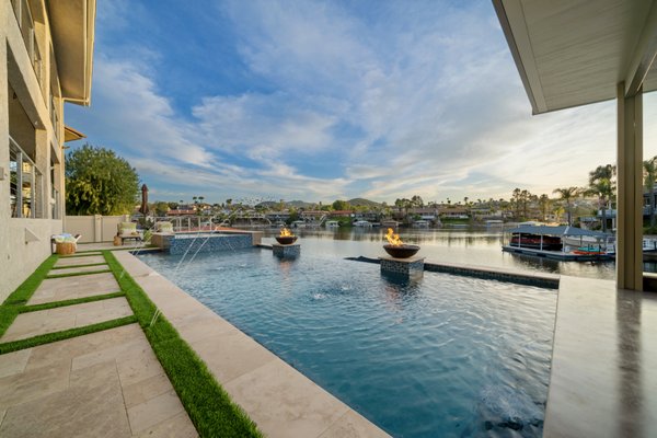 Lakeside View - This project was engineered to be build completely on a down slope to the lakes edge with massive footings and walls to hold it all up. Nothing will topple this over. Beautiful fully loaded pool project with so many features. Look through the pictures for more...
