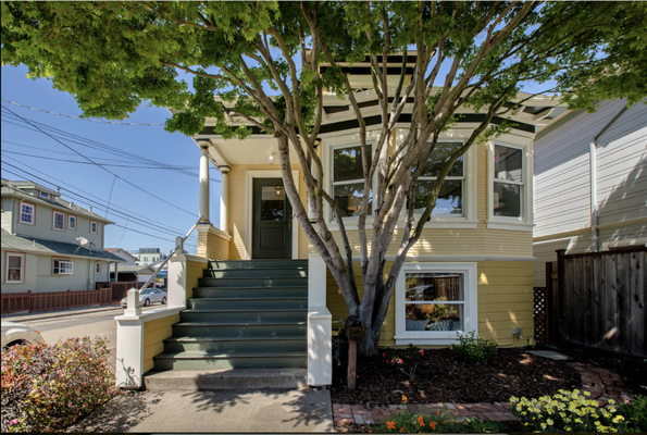 1521 PACIFIC AVENUE | CENTRAL - https://katemccaffrey.com/listings-2024-1521-pacific-avenue/

Built in 1908 on a Central Alameda street lined with picturesque Craftsman and Victorian homes, this beautiful Colonial Revival home is filled with preserved original features blended seamlessly with 21st century updates. Situated on a sunny corner lot, this spacious duplex features a flexible floor plan with two bedrooms, one bathroom, a laundry room and formal living and dining rooms in the main upstairs owner unit, plus two bedrooms, a large family room and eat-in kitchen in the lower garden apartment with its own private entrance. The home offers wonderful curb appeal with a lush front garden, a picket fence, and gorgeous exterior architectural details largely unchanged over nearly one-hundred-twenty years.

Inside, the primary owner unit is simply stunning. Large rooms, abundant sunlight and nine-foot coved ceilings are just some of the elegant details that make this home so special. A transitional entrance hall leads to formal living and dining rooms filled with beautifully preserved original features. The living room features high baseboards, picture rails, a leaded glass transom window, and large bay windows providing views of the front garden and a beautifully sculptural Japanese maple tree. A vintage hardwood floor extends into the dining room with high wainscoting, the original built-in china sideboard cabinet, and a gorgeous fireplace with a Victorian-style ornamental oak mantel, a cast iron Georgian-style fireplace insert and lovely faience tiles on the surround and hearth.

The kitchen, situated behind the dining room, has been tastefully remodeled, keeping the home's age and vintage aesthetics in mind. Plenty of warm, cinnamon-colored cabinets and drawers provide abundant kitchen storage and complements the soapstone counters, simple white subway-tile backsplash and the white porcelain farmhouse sink. Premium stainless steel appliances include a Fisher & Paykel refrigerator and dishwasher, plus a five-burner gas range with a stainless Zephyr chimney-style range vent. The updated laundry room has a Bosch washer and dryer, storage shelving and rustic floor tiles.

The large primary bedroom includes picture rails, an oak floor, a closet with custom California Closets organizers, and loads of natural light accentuated through a wall of bay windows and a nine-foot ceiling. The home's second bedroom is also generously sized, and has many of the same features as the primary bedroom. The rooms are connected by a remodeled bathroom with a large walk-in shower, white subway tiles, a storage cabinet and period fixtures.

The downstairs garden unit has two separate entrances, and offers many flexible uses. The permitted, self-contained apartment can be used for short or long term rental income, a level-in in-law unit, or combining the owner unit to create a large single family residence with an expansive family room, kitchen, large bathroom and additional bedrooms and/or home office spaces. Completely updated and move-in-ready, this sunny apartment is a valuable addition to the home! Both the owner and garden units have direct access to the wonderful backyard space that includes a detached garage converted into a finished studio or workshop.

1521 Pacific Ave offers the chance to acquire a home imbued with the classic charm of a carefully preserved and thoughtfully updated early 20th-century home expanded to include many income-producing opportunities. Located just minutes to downtown Park Street, Nob Hill Foods and freeways, this one-of-a kind home is truly a vintage jewel.