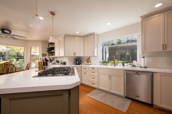 Refined Reface - Kitchen Remodel - With this project, some simple cosmetic upgrades with cabinet refacing elevated the entire space so the existing layout was preserved, but the cabinetry was refreshed with smooth, beautifully painted fronts that introduced a cleaner, more sophisticated profile.
The soft paint tones, stacked tile backsplash, new countertops and vibrant golden hardware created a timeless look without breaking the budget.
With our team we have a full service construction and design crew with the aid of our one-stop-shop materials gallery, Rocklin Kitchen & Bath Showroom. We can assist you in curating your beautiful design, with color curations, 3D rendering services, and samples for you to take home.
Contact us today to book a consultation with Guy Biggs Construction and let us help you create the kitchen you’ve always envisioned! Refined Reface - Kitchen Remodel - With this project, some simple cosmetic upgrades with cabinet refacing elevated the entire space so the existing layout was preserved, but the cabinetry was refreshed with smooth, beautifully painted fronts that introduced a cleaner, more sophisticated profile.
The soft paint tones, stacked tile backsplash, new countertops and vibrant golden hardware created a timeless look without breaking the budget.
With our team we have a full service construction and design crew with the aid of our one-stop-shop materials gallery, Rocklin Kitchen & Bath Showroom. We can assist you in curating your beautiful design, with color curations, 3D rendering services, and samples for you to take home.
Contact us today to book a consultation with Guy Biggs Construction and let us help you create the kitchen you’ve always envisioned!