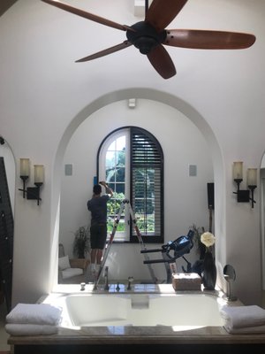 Large arched shutter installation - This customer wanted to change out their extra large white arched shutter for a dark wood one Large arched shutter installation - This customer wanted to change out their extra large white arched shutter for a dark wood one