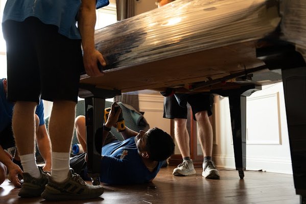 Piano Moving - This job was for moving a baby grand piano. They take special equipment and knowledge to move safely. As you can see in the photos, our movers take off the legs, flip the piano on its end on a piano board, and utilize our lift gates to safely move it on the truck. We only send veteran and experienced movers to move baby grand pianos. We also come equipped with all the necessary tools such as piano board, door jams, pads, straps, and lift gate trucks. Piano Moving - This job was for moving a baby grand piano. They take special equipment and knowledge to move safely. As you can see in the photos, our movers take off the legs, flip the piano on its end on a piano board, and utilize our lift gates to safely move it on the truck. We only send veteran and experienced movers to move baby grand pianos. We also come equipped with all the necessary tools such as piano board, door jams, pads, straps, and lift gate trucks.