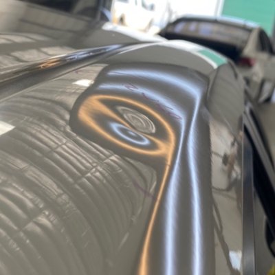 Hail Repair - Large dent on the rail of this customers vehicle. Repaired with No bondo, no fillers, or paint! Contact us for a Free Estimate on your hail damage!