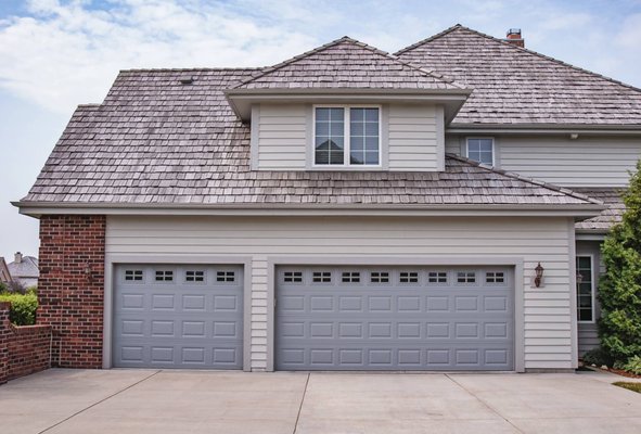 RAISED PANEL GARAGE DOORS - Reliable, low-maintenance raised panel garage doors for those who know that the classics never go out of style.
Available in short and long panel options, the recessed edge and slightly raised interior surface of our panels add depth and definition to this neighborhood staple. RAISED PANEL GARAGE DOORS - Reliable, low-maintenance raised panel garage doors for those who know that the classics never go out of style.
Available in short and long panel options, the recessed edge and slightly raised interior surface of our panels add depth and definition to this neighborhood staple.