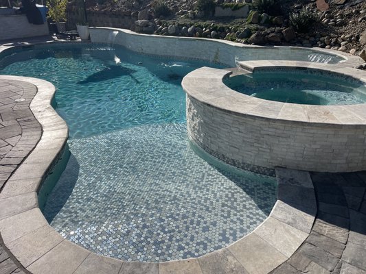 Pool Remodel - This project was a full remodel , All new Plumbing , Coping , Tile , Pebble , Tiled pool entry and benches
Raised wall with ledger stone and water feature Pool Remodel - This project was a full remodel , All new Plumbing , Coping , Tile , Pebble , Tiled pool entry and benches
Raised wall with ledger stone and water feature