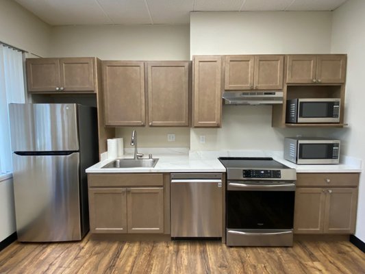Kitchen Cabinetry - This is a company breakroom. It is a partial overlay cabinet, style: Galvyn color: Buckskin Kitchen Cabinetry - This is a company breakroom. It is a partial overlay cabinet, style: Galvyn color: Buckskin