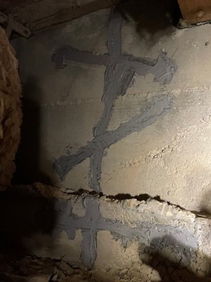 Fracture through foundation wall - This foundation had settled and caused a fracture, by using our method of drilling into the concrete and using carbon fiber and structural grade epoxy does not allow the foundation to separate anymore and holds it together.