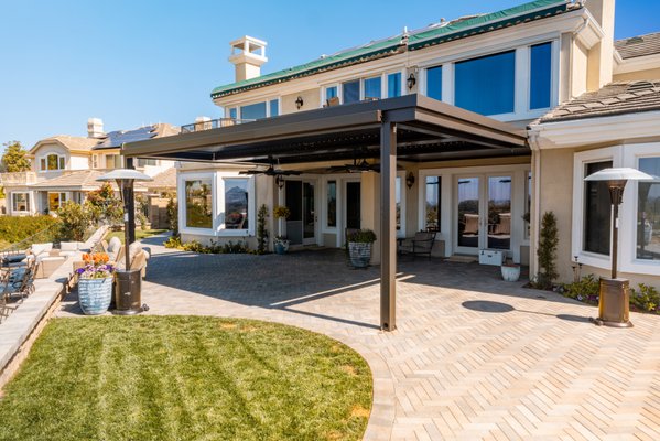 Villa Park - This a frontyard and backyard remodel. The scope included a new driveway, retaining walls, backyard patio with a Struxure patio cover, new custom BBQ and custom Fireplace, synthetic grass putting green, irrigation, low voltage lighting, SOD and custom wrought iron. We also added some custom hangman lights for the BBQ area as well. Villa Park - This a frontyard and backyard remodel. The scope included a new driveway, retaining walls, backyard patio with a Struxure patio cover, new custom BBQ and custom Fireplace, synthetic grass putting green, irrigation, low voltage lighting, SOD and custom wrought iron. We also added some custom hangman lights for the BBQ area as well.