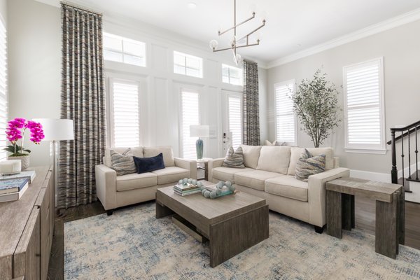 Whole Home Refresh - This whole home refresh gave the homeowner a little bit of everything - fresh paint, custom wood paneling, designer light fixtures, and premium stone surfaces to complement a stunning fireplace.