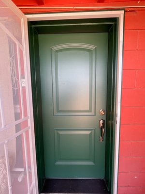 Front Entry Door Replacement - We replaced an outdated, worn entry door with a secure and stylish new green steel door that complements the home’s exterior and improves curb appeal. A fresh look and upgraded hardware now welcome guests and dwellers with both beauty and durability.