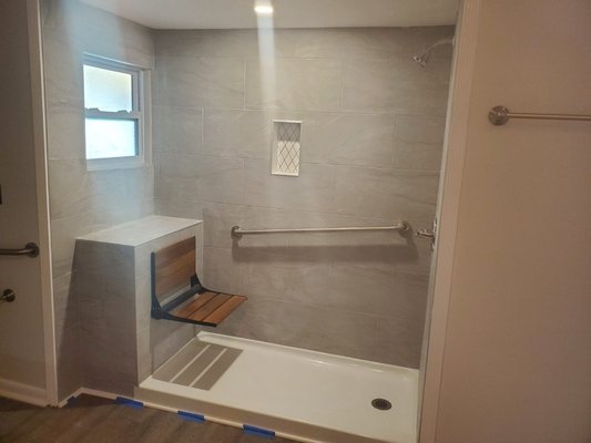 Bathroom Remodel - Bathtub to walk-in shower remodel.  Handicap accessible with window, safety bars, bench and shower bars. The complete project took 15 business days.