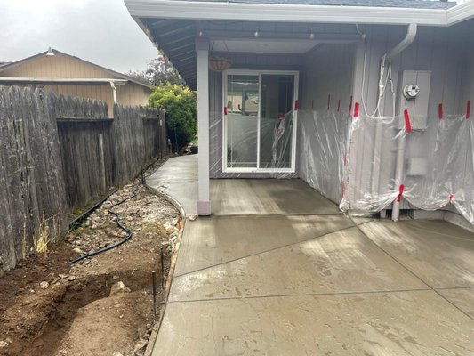 Concrete Pour - This client asked for a repour for their their back porch section because it was worn, cracked, and slanted towards the house, causing water buildup and flooding. We tore out the existing concrete and repoured it as well as two new slabs for a gazebo and tool shed. Concrete Pour - This client asked for a repour for their their back porch section because it was worn, cracked, and slanted towards the house, causing water buildup and flooding. We tore out the existing concrete and repoured it as well as two new slabs for a gazebo and tool shed.
