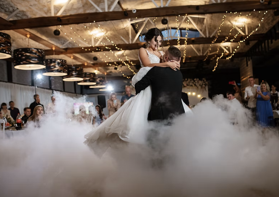 Dancing on the Clouds - Imagine gliding across a sea of soft, fluffy clouds as you take your first dance or celebrate a special moment with your guests—dancing on the clouds creates a dreamlike atmosphere that will leave everyone in awe. Our dancing on the clouds effect uses a safe, low-lying fog that stays close to the ground, giving the illusion of floating above the clouds. Whether it’s for your wedding, a grand entrance, or any moment you want to make unforgettable, this magical touch will elevate the vibe and create breathtaking photo opportunities. It’s a moment of pure enchantment that will have your guests talking long after the event ends. Make your celebration truly one-of-a-kind with dancing on the clouds! Dancing on the Clouds - Imagine gliding across a sea of soft, fluffy clouds as you take your first dance or celebrate a special moment with your guests—dancing on the clouds creates a dreamlike atmosphere that will leave everyone in awe. Our dancing on the clouds effect uses a safe, low-lying fog that stays close to the ground, giving the illusion of floating above the clouds. Whether it’s for your wedding, a grand entrance, or any moment you want to make unforgettable, this magical touch will elevate the vibe and create breathtaking photo opportunities. It’s a moment of pure enchantment that will have your guests talking long after the event ends. Make your celebration truly one-of-a-kind with dancing on the clouds!