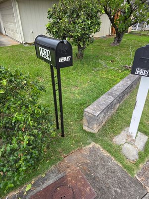 New mailbox - After strong winds, the mailbox broke. I dug a hole, concreted the posts 4 inches below ground level, waterproofed the posts to grass height so they wouldn't rust from the wet ground, covered them with soil, and put grass in place. The owner really liked it.
