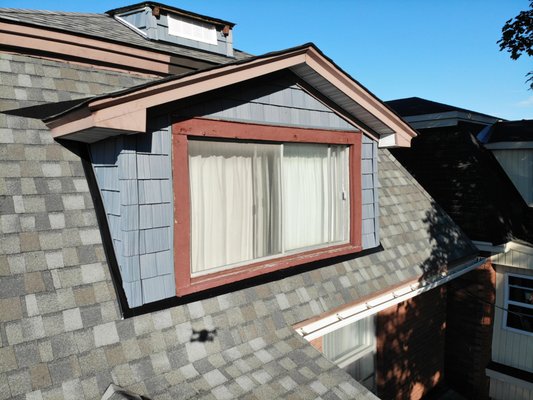Full Re-Roof, Siding and Eavestroughing - This house was completed in one week by Walter Aquila Roofing Crew! Due to the age of the house there had been some damage to the framing which had to be repaired before installing the new roof.  the dormers were sided with Gentek Foundry Perfection Shake Siding and the roof was completed with CertainTeed Landmark PRO shingles