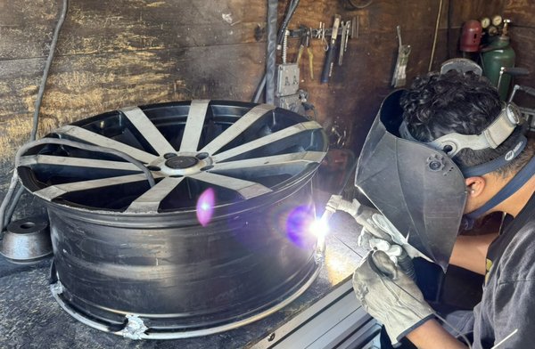 Wheel repair - This customer had cracks on her wheel causing her tire to leak air. She brought it to us to repair her wheel.