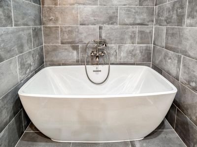 Bathroom Remodel - This bathroom remodel was completed in 2021.  The entire bathroom was gutted and remodeled with a new shower, double sink, tub, and sliding pocket doors.
