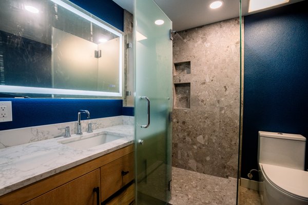 A Guestbath in Bold Bathroom Remodeling - Experience the perfect intersection of bold personality and premium craftsmanship. This dual-bathroom renovation on Mobley St showcases Vesta Builders' ability to master vibrant color palettes from deep emerald greens to striking navy blues without sacrificing a sense of luxury. Featuring custom LED-integrated mirrors, fluted wall textures, these spaces were engineered to be both visually stunning and highly functional. Whether it’s a spa-like master retreat or a high-design guest bath, we bring an organized, design-build approach to every square inch. A Guestbath in Bold Bathroom Remodeling - Experience the perfect intersection of bold personality and premium craftsmanship. This dual-bathroom renovation on Mobley St showcases Vesta Builders' ability to master vibrant color palettes from deep emerald greens to striking navy blues without sacrificing a sense of luxury. Featuring custom LED-integrated mirrors, fluted wall textures, these spaces were engineered to be both visually stunning and highly functional. Whether it’s a spa-like master retreat or a high-design guest bath, we bring an organized, design-build approach to every square inch.