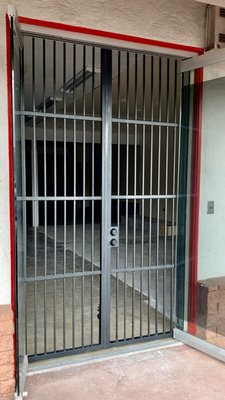 Custom Iron Security Gate - Business Protection - This custom-built iron gate, meticulously crafted by McMaster Iron, provides robust security for this commercial property. The gate's design seamlessly blends functionality with aesthetic appeal, ensuring both protection and enhancement of the property's overall appearance.