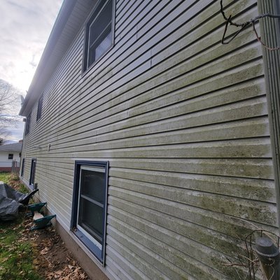 Residential SoftWash - This was a softwashing project we did in March of 2025. 

Softwashing is a cleaning method that uses low-pressure water combined with specialized cleaning solutions to remove dirt, algae, mold, and mildew from surfaces like vinyl siding. Unlike pressure washing, which uses high-pressure water that can potentially damage siding, softwashing is much gentler and safer for delicate materials.

**Why softwashing is safer for vinyl siding:**
- **Low Pressure:** Softwashing uses a low-pressure spray, reducing the risk of cracking, denting, or loosening the vinyl panels.
- **Effective Cleaning Solutions:** The cleaning agents break down and kill organic growth, so there’s no need for forceful scrubbing or blasting.
- **Prevents Water Intrusion:** High-pressure washing can force water behind the siding, leading to mold or rot. Softwashing minimizes this risk.