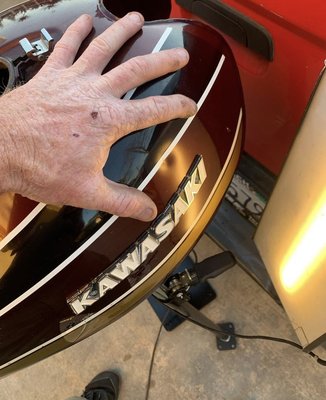 Motorcycle gas tank dent - This Kawasaki motorcycle gas tank was repaired in less than two hours. Motorcycle gas tank dent - This Kawasaki motorcycle gas tank was repaired in less than two hours.