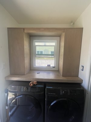 Laundry room storage - In September 2021 I was contracting to build a custom floating countertop and cabinets. Materials used were birch plywood and client desired stain.