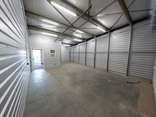 Business Suite - In addition to traditional storage units, we have 600 and 700 square foot business suite units. These spaces have large 10'+ roll up garage doors, high ceilings, lighting and power (110v), with attached offices with air conditioning and internet.
We are targeting businesses who primarily work in the field but need a warehouse/office space to store material or vehicles, to stock merchandise, work on projects and to manage business operations. Business Suite - In addition to traditional storage units, we have 600 and 700 square foot business suite units. These spaces have large 10'+ roll up garage doors, high ceilings, lighting and power (110v), with attached offices with air conditioning and internet.
We are targeting businesses who primarily work in the field but need a warehouse/office space to store material or vehicles, to stock merchandise, work on projects and to manage business operations.