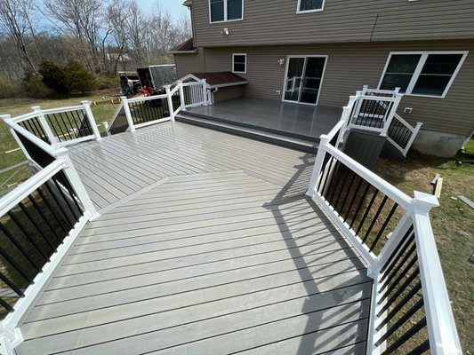 Double Level, Sea-Salt Gray Deck - Here is a beautiful double level, 20x31 sea-salt gray TimberTech deck with a 12’ octagon. This deck features white vinyl railing with square black metal balusters and solid skirting to the ground.
Call us today to discuss your next deck project! Double Level, Sea-Salt Gray Deck - Here is a beautiful double level, 20x31 sea-salt gray TimberTech deck with a 12’ octagon. This deck features white vinyl railing with square black metal balusters and solid skirting to the ground.
Call us today to discuss your next deck project!
