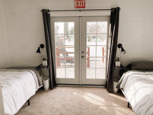 Shared Room - Our Shared room features individual 32" retractable TVs, individual dressers, and shared closet. Large French doors provide excellent lighting and easy access to a private deck and ramp.