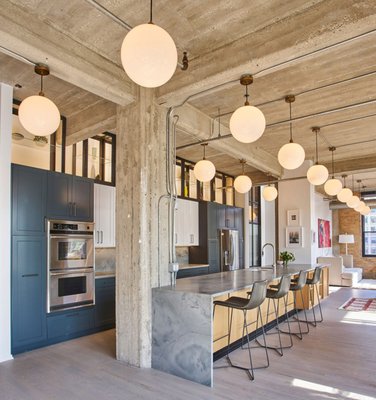 Custom White Oak Chevron - This was a very unique project in west loop where we refinished 2500 sf of red oak strip flooring with a water base dye and a custom stain to tone down the pink hue from red oak . The project was featured in Curbed Chicago and over many social media outlets.