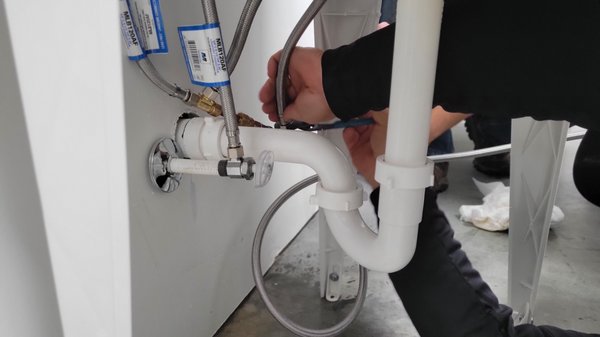 Refrigerator Line - While we were moving in to our new office, we needed to install a new refrigerator line. Steve tied the new line in to the existing water supply on the sink. Now we have ice and cold water in the shop. Great job!