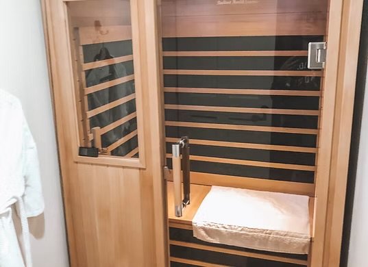 Far Infrared Sauna - Step into our infrared sauna and experience a deeper level of relaxation and rejuvenation. Unlike traditional saunas, our infrared sauna uses infrared light to penetrate the body, promoting increased collagen production, pain relief, improved circulation, and stress reduction. With gentle, soothing heat, you can unwind, release tension, and enhance your overall well-being. Far Infrared Sauna - Step into our infrared sauna and experience a deeper level of relaxation and rejuvenation. Unlike traditional saunas, our infrared sauna uses infrared light to penetrate the body, promoting increased collagen production, pain relief, improved circulation, and stress reduction. With gentle, soothing heat, you can unwind, release tension, and enhance your overall well-being.