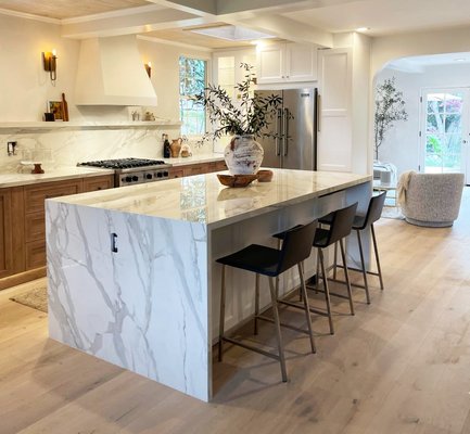 Kitchen remodeling, countertops & cabinets - This complete kitchen remodeling includes countertops with a middle-high backsplash shelf made from the same material. Our company designer has created a beautiful island with lower cabinets on one side and enough space for three stools on the other. The wood cabinets have been upgraded with touch-to-open hardware for added convenience. Kitchen remodeling, countertops & cabinets - This complete kitchen remodeling includes countertops with a middle-high backsplash shelf made from the same material. Our company designer has created a beautiful island with lower cabinets on one side and enough space for three stools on the other. The wood cabinets have been upgraded with touch-to-open hardware for added convenience.