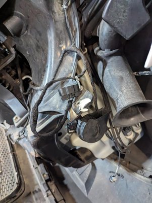 Wiring Harness Repair - This was a 2014 GMC Acadia that the headlights weren't working properly on. The customer mentioned that it had been in an accident before and the lights hadn't worked properly ever since they got it back from the body shop. We did a fault scan in the body control module and there were several circuit codes for the headlight circuits. We found that the light assemblies were replaced with used headlights that did not match up to the harness, so the body shop did some very poor splicing and even ran a wire to the other side right across the top of the radiator. Once we removed all of the "extra" wires and made sure that all of the connector pins matched with the wiring diagram, all lights in the front of the vehicle were working as originally designed. Wiring Harness Repair - This was a 2014 GMC Acadia that the headlights weren't working properly on. The customer mentioned that it had been in an accident before and the lights hadn't worked properly ever since they got it back from the body shop. We did a fault scan in the body control module and there were several circuit codes for the headlight circuits. We found that the light assemblies were replaced with used headlights that did not match up to the harness, so the body shop did some very poor splicing and even ran a wire to the other side right across the top of the radiator. Once we removed all of the "extra" wires and made sure that all of the connector pins matched with the wiring diagram, all lights in the front of the vehicle were working as originally designed.