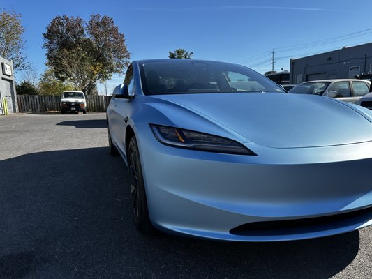 Tesla Model 3 Matte Blue Wrap – From Grey to Bold Elegance - At AboutCars, we gave this Tesla Model 3 a complete transformation with a sleek matte blue vinyl wrap, replacing its original grey finish. This eye-catching color change not only enhances the vehicle’s modern design but also adds a sophisticated, stealthy look with the matte finish.
Our expert installation ensures a seamless, factory-like appearance with precision around every panel and curve. Plus, the vinyl wrap acts as a protective shield, preserving the original paint from scratches, UV damage, and road debris.
Want to elevate your Tesla’s style? Visit AboutCars in Rockville/Derwood for top-quality vinyl wraps and customization! Tesla Model 3 Matte Blue Wrap – From Grey to Bold Elegance - At AboutCars, we gave this Tesla Model 3 a complete transformation with a sleek matte blue vinyl wrap, replacing its original grey finish. This eye-catching color change not only enhances the vehicle’s modern design but also adds a sophisticated, stealthy look with the matte finish.
Our expert installation ensures a seamless, factory-like appearance with precision around every panel and curve. Plus, the vinyl wrap acts as a protective shield, preserving the original paint from scratches, UV damage, and road debris.
Want to elevate your Tesla’s style? Visit AboutCars in Rockville/Derwood for top-quality vinyl wraps and customization!