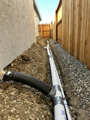 Drain installation - The previous drain system was fully clogged with soil and roots. We opened, removed and installed a brand new non-perforated drain system, which all of the gutters tied into it. in the meantime since their irrigation mainline was so damaged. We went ahead and installed a brand new one . Drain installation - The previous drain system was fully clogged with soil and roots. We opened, removed and installed a brand new non-perforated drain system, which all of the gutters tied into it. in the meantime since their irrigation mainline was so damaged. We went ahead and installed a brand new one .