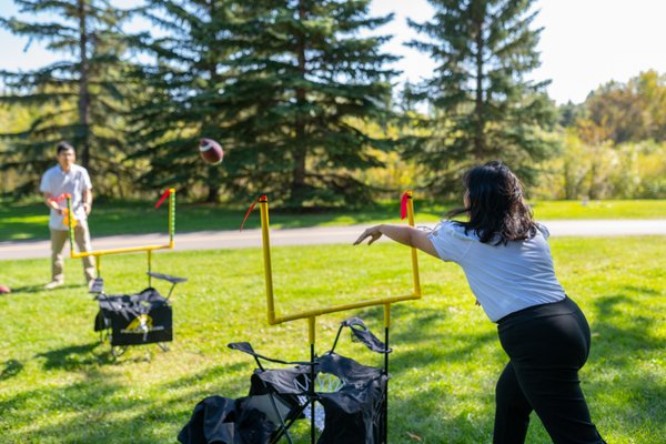QB54 - Are you ready for some football? - QB54 is a unique and exciting game that combines elements of football and bean bag toss. Players aim to score points by throwing bean bags through specially designed target holes attached to collapsible chairs.
Engage in the ultimate hybrid of football and bean bag toss with QB54, a game that combines accuracy, teamwork, and a competitive edge in a unique and action-packed challenge. Whether you're aiming for the target, celebrating a successful throw, or enjoying the camaraderie of team play, Moose & Maple Games' QB54 rental guarantees an electrifying and memorable experience. Gather your friends and family for a game that's perfect for outdoor fun and friendly rivalry, and get ready to make unforgettable memories on the field. QB54 - Are you ready for some football? - QB54 is a unique and exciting game that combines elements of football and bean bag toss. Players aim to score points by throwing bean bags through specially designed target holes attached to collapsible chairs.
Engage in the ultimate hybrid of football and bean bag toss with QB54, a game that combines accuracy, teamwork, and a competitive edge in a unique and action-packed challenge. Whether you're aiming for the target, celebrating a successful throw, or enjoying the camaraderie of team play, Moose & Maple Games' QB54 rental guarantees an electrifying and memorable experience. Gather your friends and family for a game that's perfect for outdoor fun and friendly rivalry, and get ready to make unforgettable memories on the field.