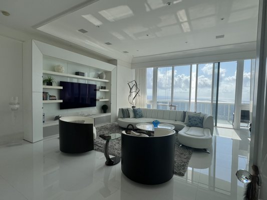 Sunny Isles high-tech high rise living - This project features a full multi-room, Crestron smart home automation system including automated shades & drapes, surround sound, smart lighting control, custom design/built media wall, & Sony TVs; all operated by intuitive touch-screen remotes, iPhones & iPad apps. Sunny Isles high-tech high rise living - This project features a full multi-room, Crestron smart home automation system including automated shades & drapes, surround sound, smart lighting control, custom design/built media wall, & Sony TVs; all operated by intuitive touch-screen remotes, iPhones & iPad apps.