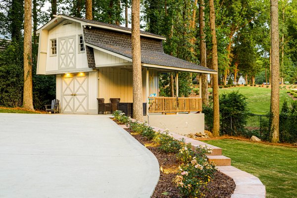 Backyard Transformation - Beautiful example of the many services we offer - driveway replacement, retaining wall, landscaping, and sod install.