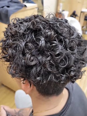 We also offer men’s perms - Elevate your style with Bombshell Extensions’ new Men’s Perms. Our expert stylists craft naturally textured, modern curls tailored just for you. Whether you’re looking for a subtle boost or a bold, statement-making look, our personalized consultation ensures your new style fits your personality and lifestyle. Turn heads with effortlessly cool, low-maintenance waves that redefine modern masculinity. Book your appointment today and experience the transformation.